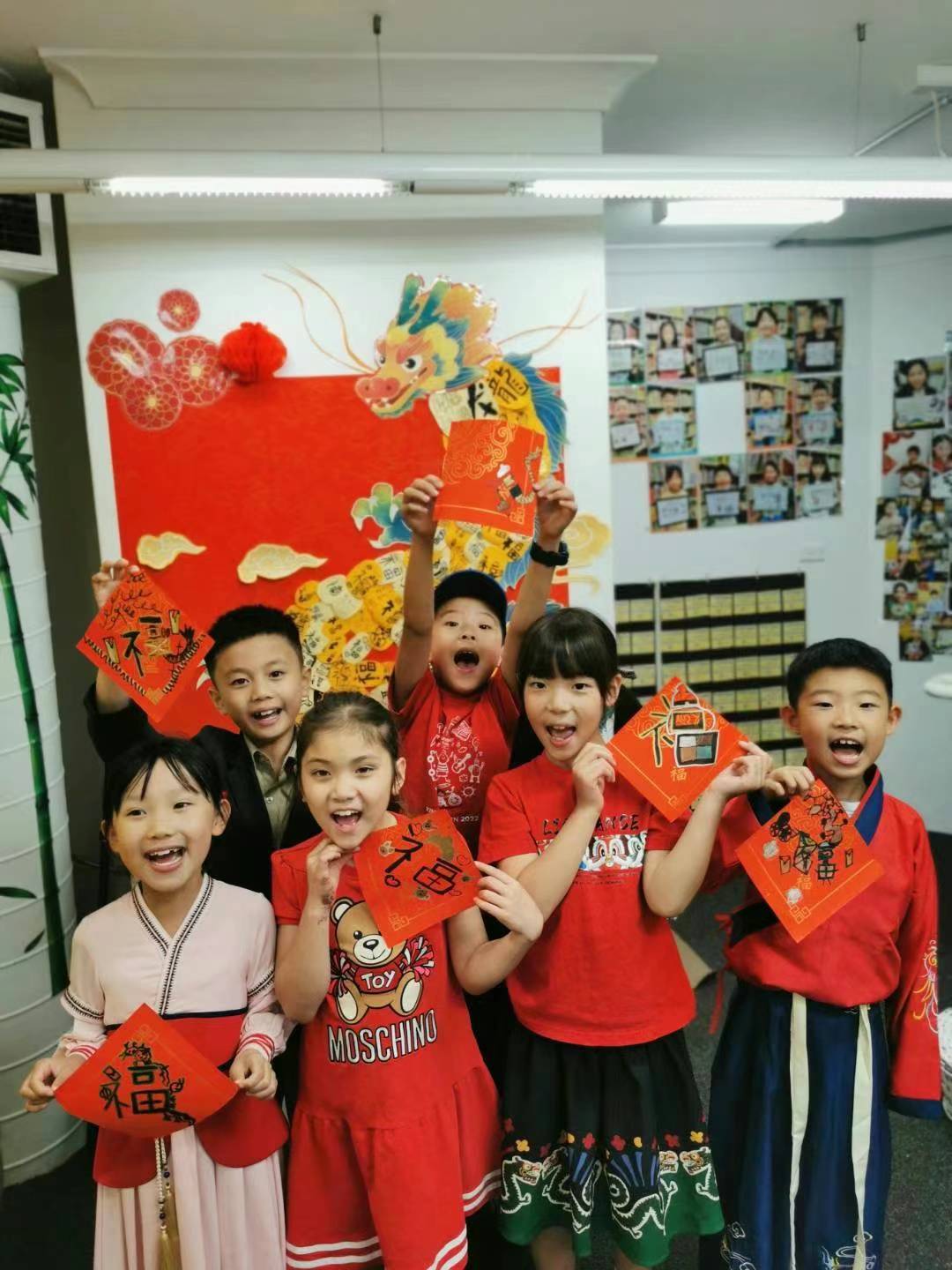 Huaxia's happy students showcasing their Chinese New Year arts and crafts during a cultural-immersion class